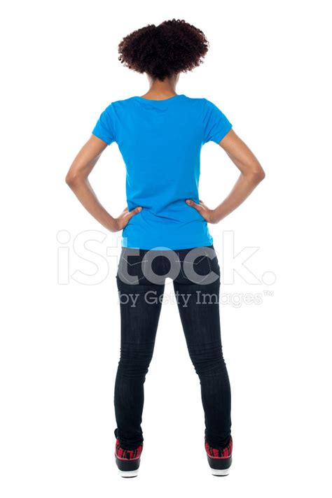 Back Pose Of Young Woman Facing Wall Stock Photo Royalty Free