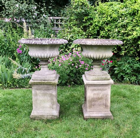 Urn pedestal help save space and substantially beautify any balcony, home, or public area in which they are placed. Pair of Classic Urn and Pedestals - New England Garden Company