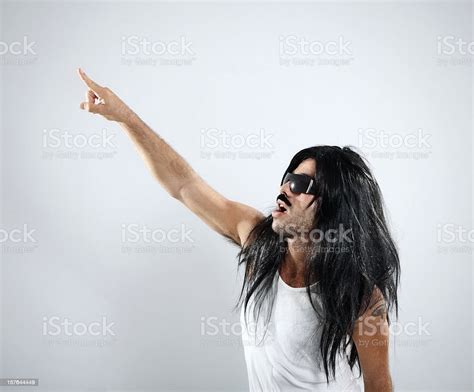 Long Haired Rocker Pointing Up Stock Photo Download Image Now 25 29