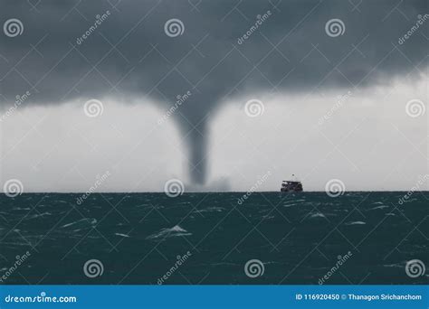 Tornado And Storm Cloud In The Sea While The Ship Is Sailing Royalty