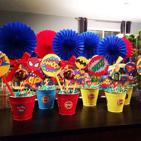 Superhero Centerpieces Using Free Printables Straws And Fans From
