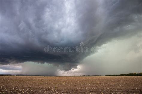 A Supercell Thunderstorm Dumps Heavy Rain And Hail Over A Field Stock