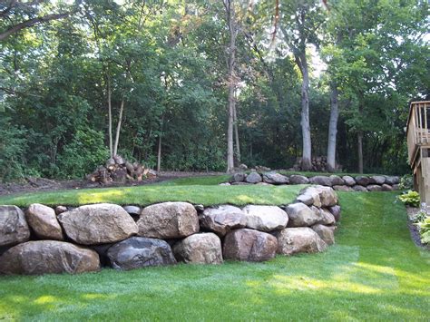 Six key factors for incorporating boulders into your yard or garden by maureen gilmer. Boulder Wall | Backyard landscaping designs, Backyard ...