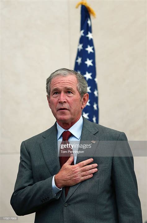 Former Us President George W Bush Puts His Hand Over His Heart