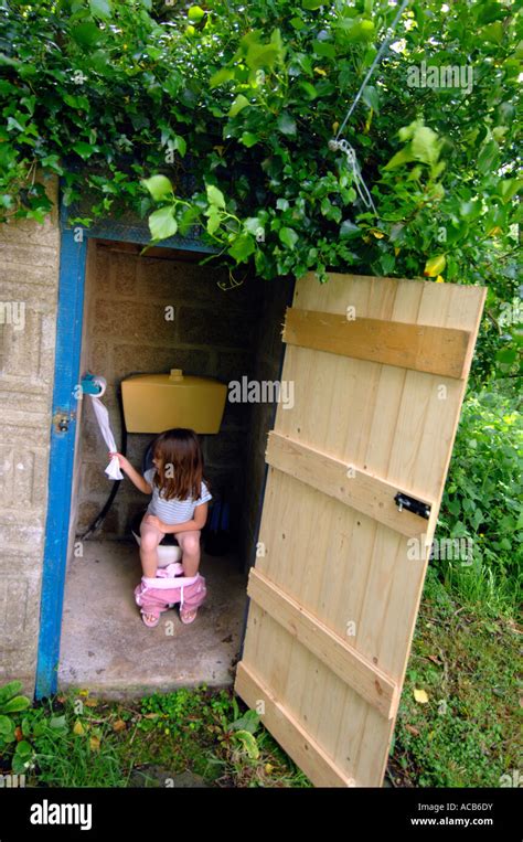 Toilet Outside Toilet Girl Using An Outdoor Toilet Stock Photo Alamy