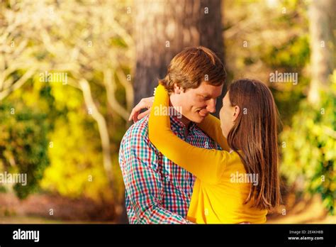 Close Portrait Of A Young Adults Lovely Couple Hug Outside In The Park