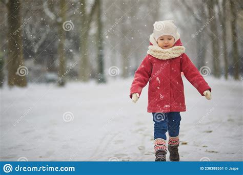 Adorable Toddler Girl On A Day With Heavy Snowfall Stock Image Image
