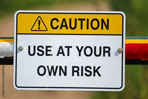 A Caution Use At Your Own Risk Sign Stock Photo Adobe Stock