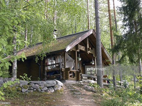 Log cabins in the woods. A Pretty Log Cabin In The Woods Stock Photo | Getty Images