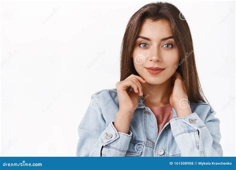Close Up Modern Stylish And Sassy Alluring Brunette Woman In Denim Jacket Touching Neck