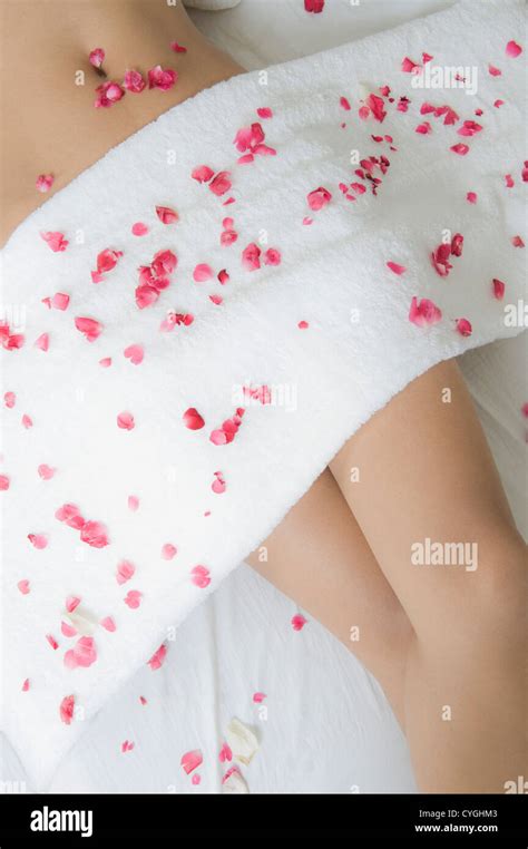 Rose Petals On A Woman Lying On A Massage Table Stock Photo Alamy