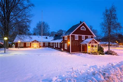 Winter Scenery With Red Wooden House In Sweden At Night Stock Photo