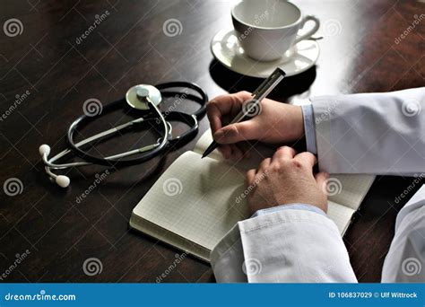 An Image Of A Writing Doctor With Stethoscope Stock Image Image Of