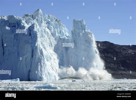 Melting Glacier Iceberg Falling Into The Sea Northwestern Greenland