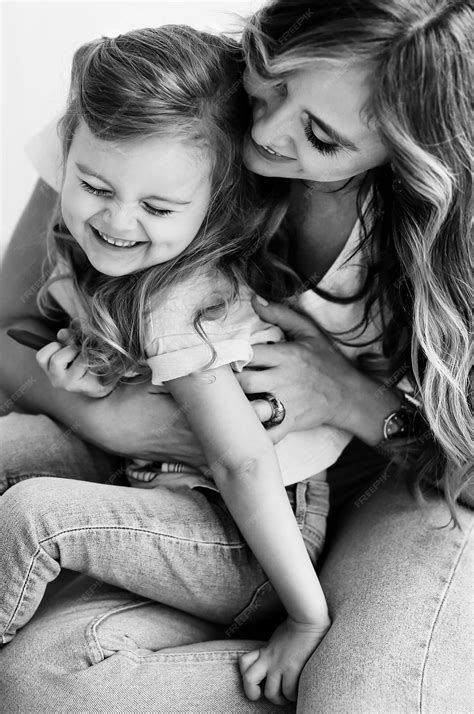 Premium Photo Portrait Of Beautiful Cheerful Mother With Her Cute Daughter Having Fun Together