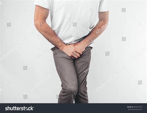 Man Holding His Penis On White Zdj Cie Stockowe Edytuj Teraz