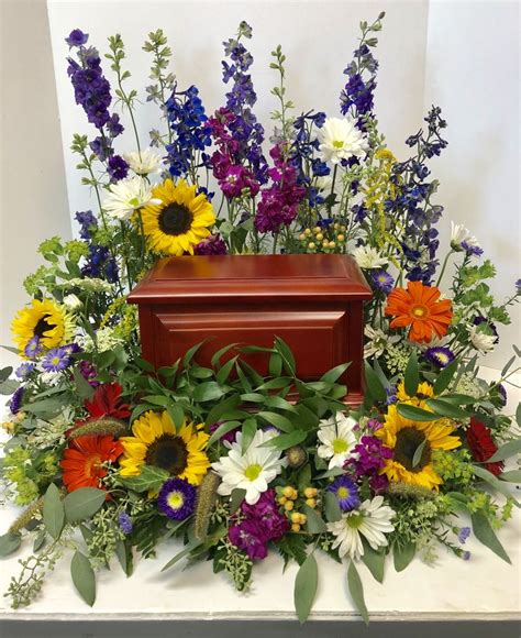Flowers speak the language of love that help convey our feelings and emotions that words fail to express. Cremation urn surround | Funeral flower arrangements ...