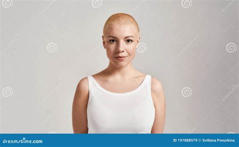 Portrait Of A Beautiful Young Caucasian Woman With Shaved Head Wearing