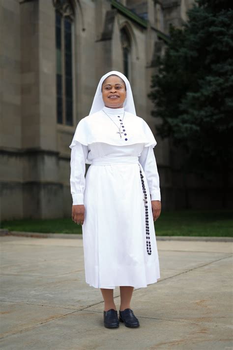 A Nun In White Religious Habit Standing Outside · Free Stock Photo