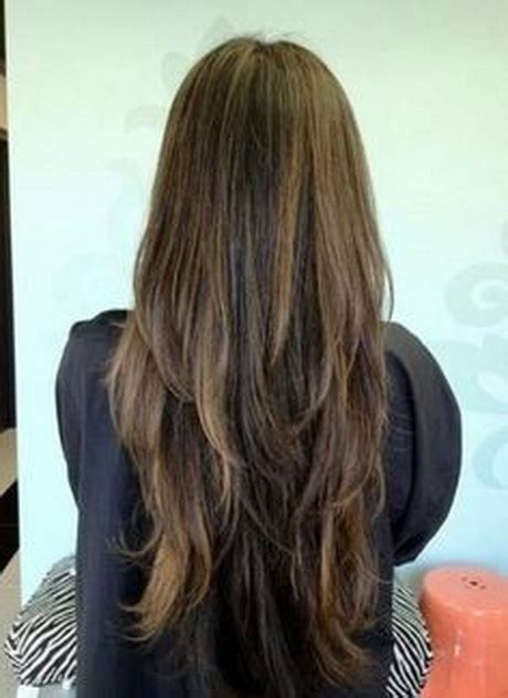 Keep all the bottom length and begin to layering the crown area of the head. V shaped layered haircut