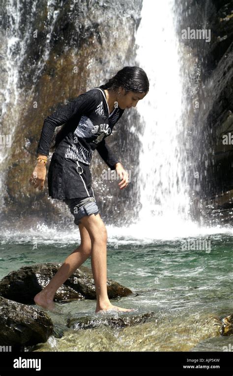 Skinny Young Indian Girl Woman Walking Bare Feet In Pond Under Waterfall Outdoors Bhagsunag