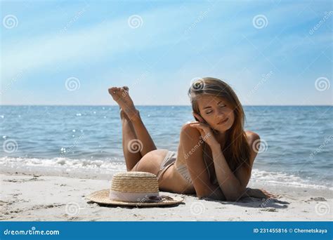 Attractive Woman In Bikini Lying On Sandy Beach Near Sea Stock Photo Image Of Nature Exotic