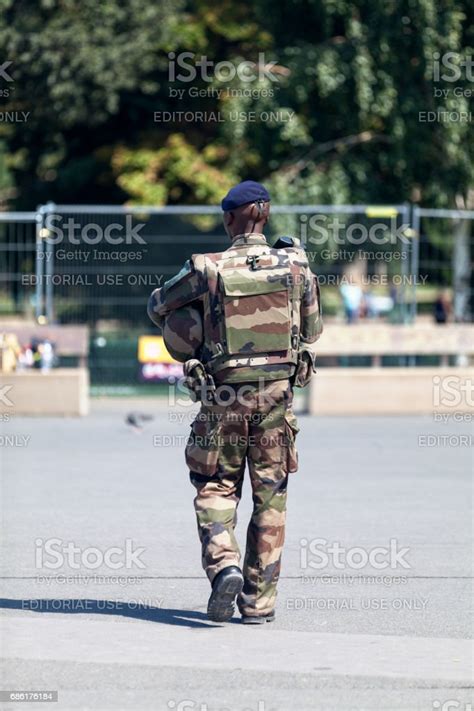 French Soldier Patrolling At The Eiffel Tower Stock Photo Download
