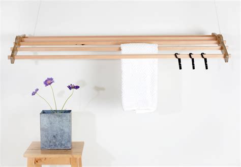 And when not in use racks collapse under an attractive top shelf that can hold supplies or decorative. Retractable Laundry Hangers : ceiling mounted rack