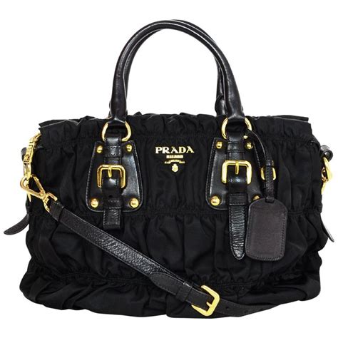 Every day by email immediately, by email and mobile notification immediately, by email immediately, by mobile notification. Prada Black Nylon Ruched Tote Bag W/ Strap For Sale at 1stdibs