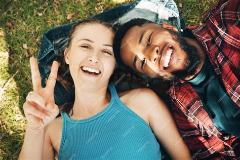 Premium Photo Interracial Couple Park And Portrait Selfie For Lying