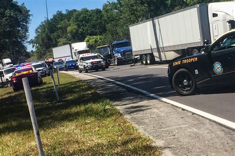 Man Wanted in Triple Killing Is Arrested After Armed Standoff on