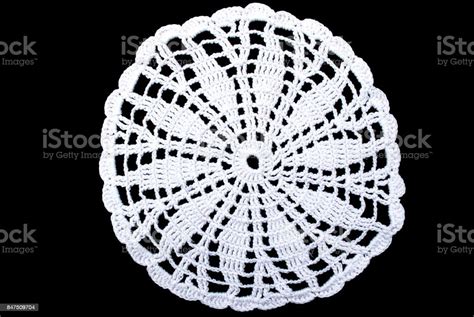 White Round Lace Tablecloth Isolated On Black Background Close Up Stock