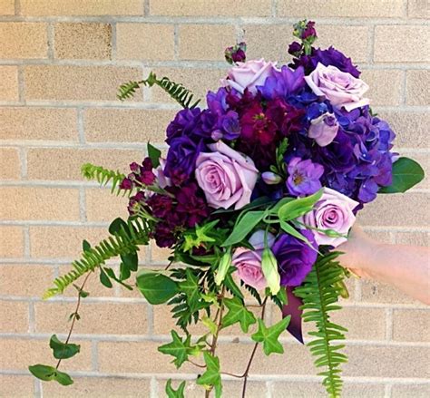 We did not find results for: Cascading bridal bouquet in shades of purple. Designed ...