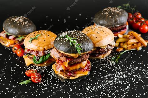 Premium Photo Many Different Burgers With Ingredients On A Black