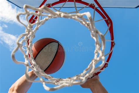 Scoring During Basketball Ball Goes Through Basket Man Throwing The