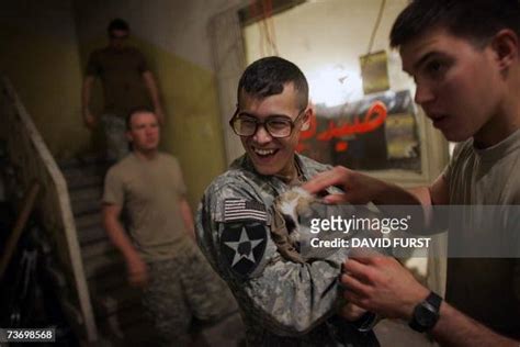 A Us Soldier From Gator Company 2 12 Infantry Battalion Laughs As He
