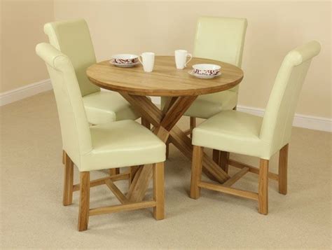 The Solid Oak Round Table With Crossed Legs And Four Cream Scroll Back