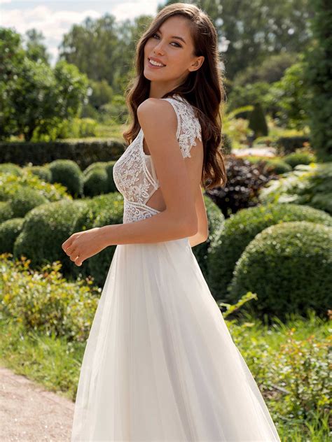 A Line Wedding Dress With A Deep V Neckline Lace Bodice And Tulle Skirt