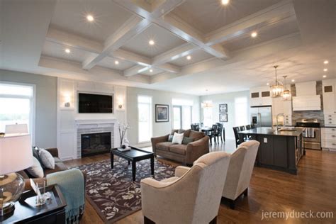 In modern times coffered ceiling often refers to a custom wooden frame over ceiling panels to create the look of the historical design. Classic Great Room with Coffered Ceiling