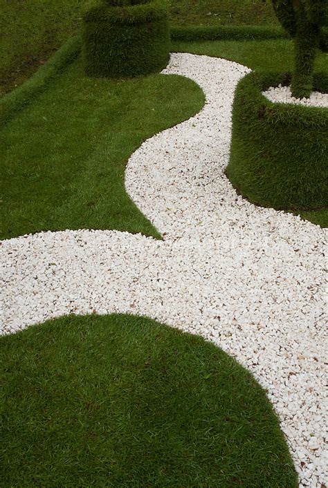 Pathway Of White Stones In Lawn Plant And Flower Stock Photography