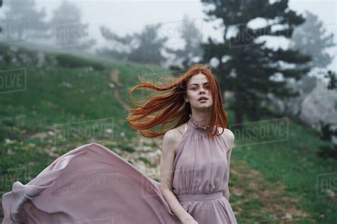 Wind Blowing Hair Of Caucasian Woman In Field Stock Photo Dissolve