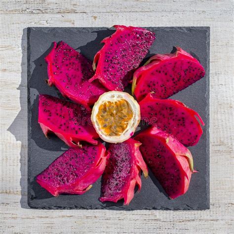 Exotic Pink Dragon Fruit Cut And Passionfruit On Background Close Up