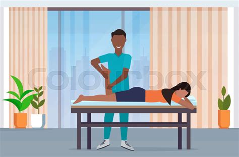 Woman Lying On Massage Table African American Masseur Therapist Doing Healing Treatment