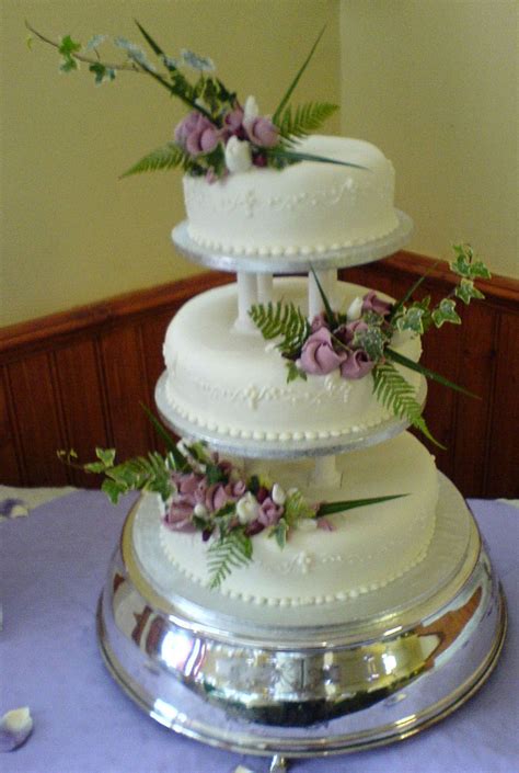 Why not embrace the traditional tiered cake, but dress it up a bit? Plum Duff Pattesirie & Party Caterers - Cakes