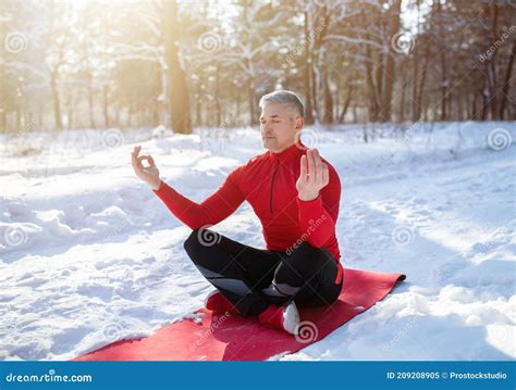 Outdoor Winter Yoga Concept Peaceful Mature Man Sitting In Lotus Pose