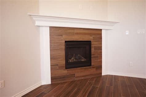Corner Gas Fireplace With Wood Tile Surround Permian Homes Odessa