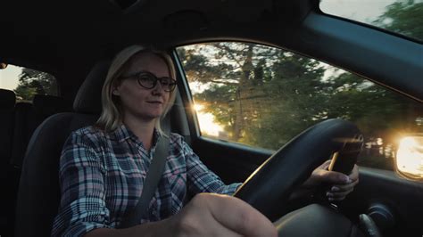 Premium Stock Video Portrait Of A Female Driver Of A Car Rides In A