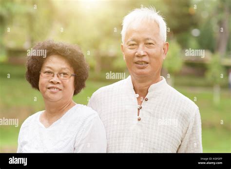 Happy Asian Old Couple Smiling At Outdoor Park Stock Photo Alamy