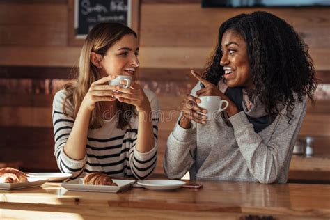 Friends Sitting In A Cafe Drinking Coffee Stock Photo Image Of