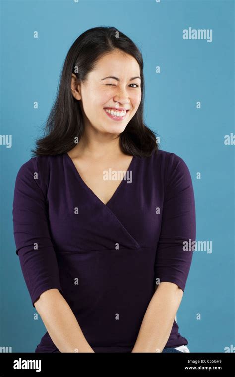 Portrait Of A Young Woman Winking Stock Photo Alamy